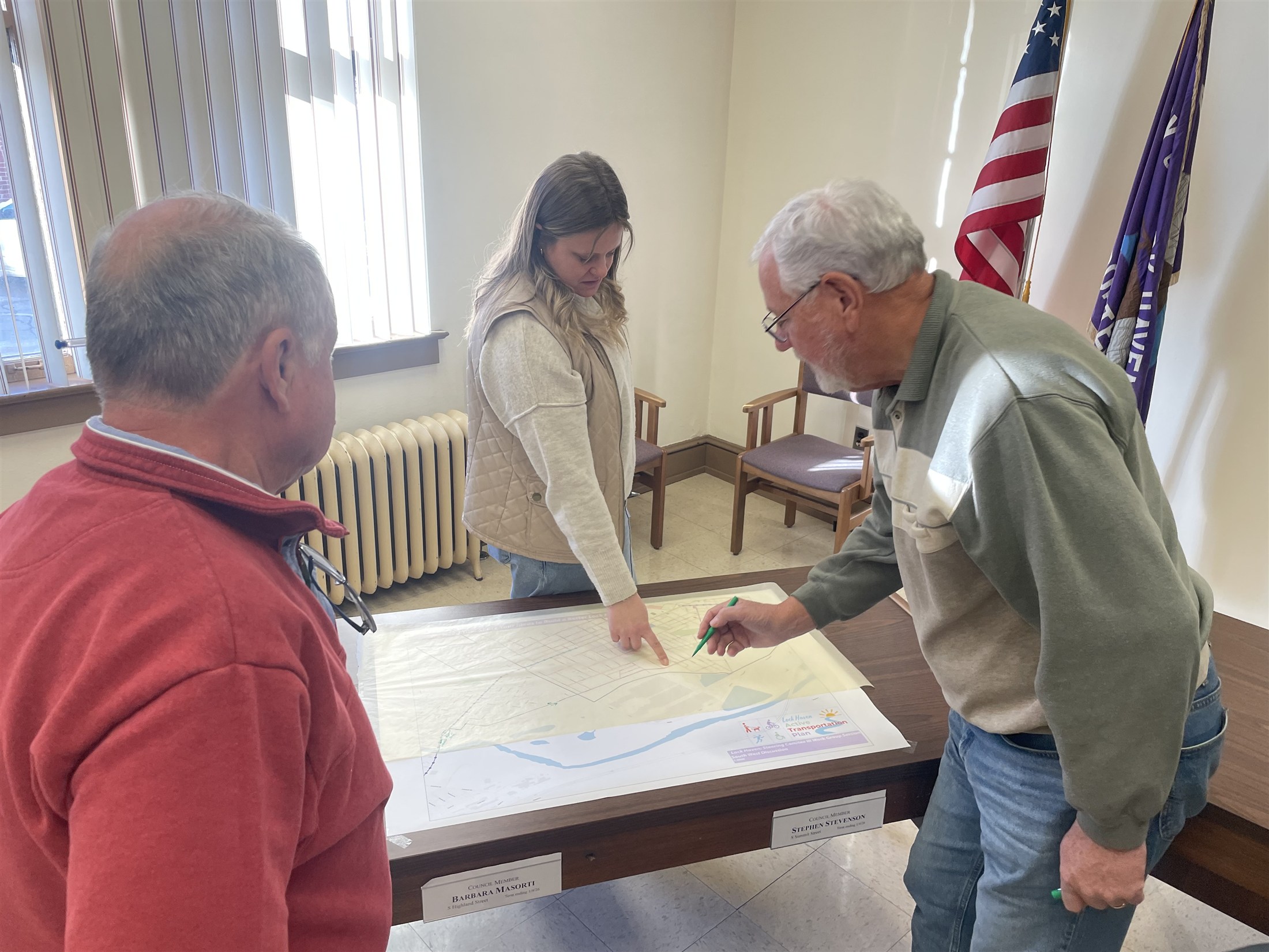Lock Haven community members collaborating with Stuart Group over a planning map